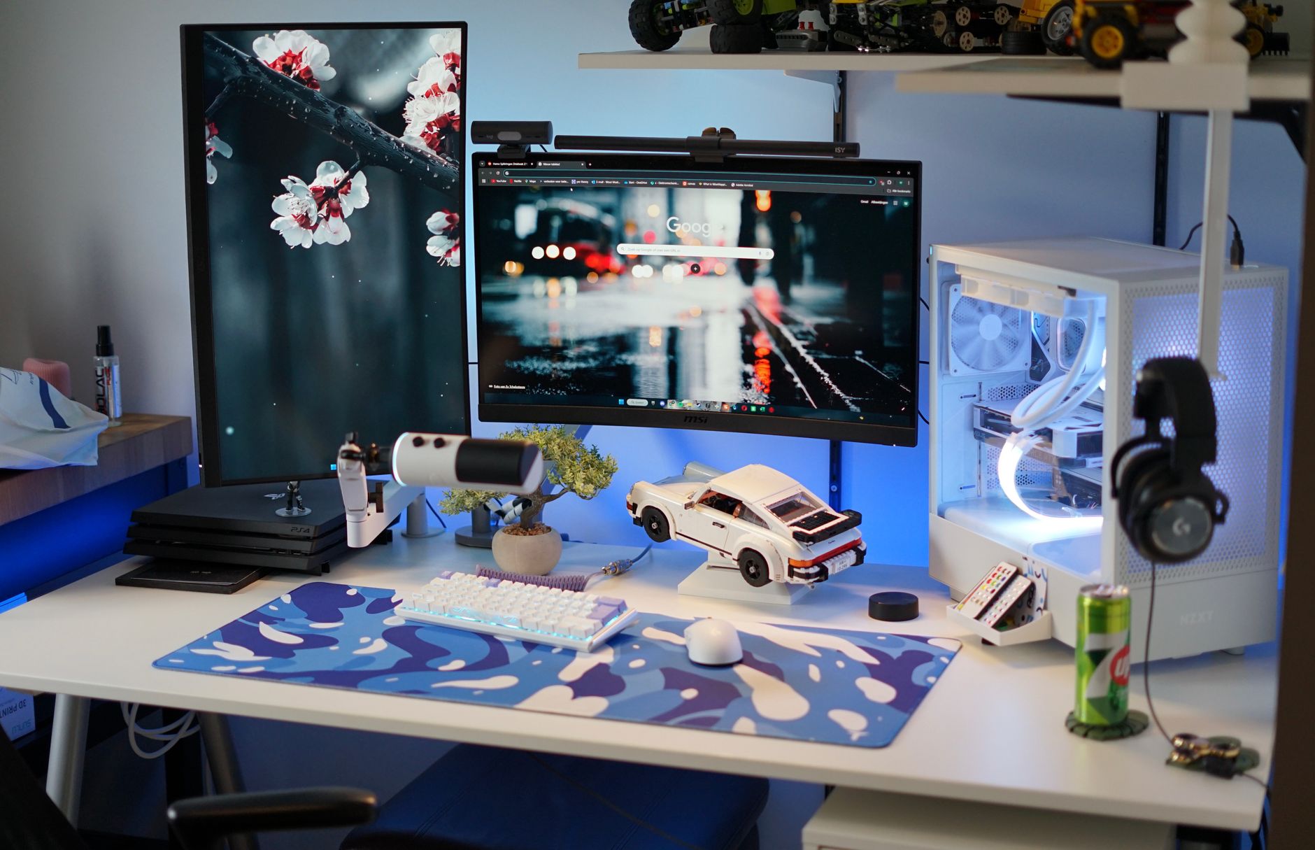 Sleek gaming setup featuring dual monitors, gaming PC, and accessories in a stylish home office.