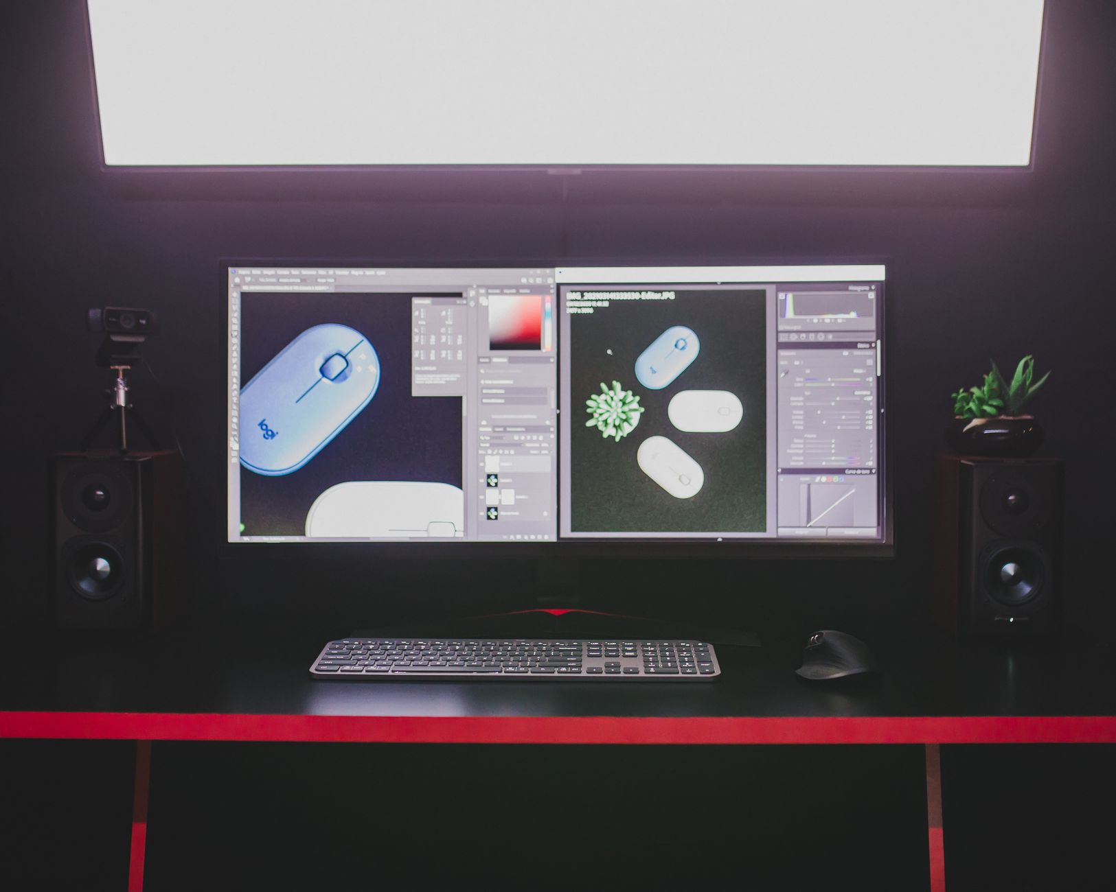 A modern desktop setup featuring dual monitors, keyboard, and mouse, ideal for graphic design.